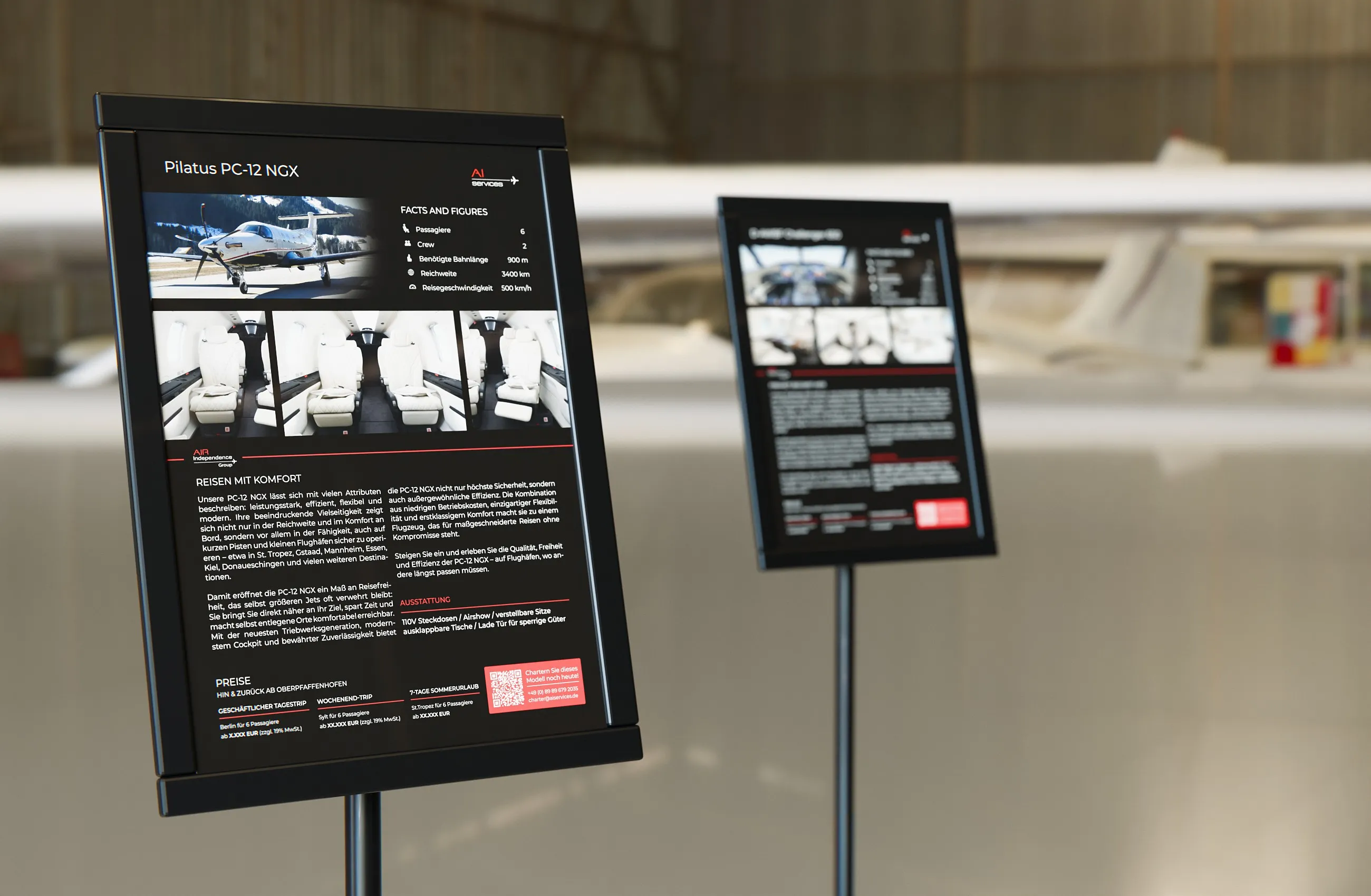 Datenblätter zur Pilatus PC-12 NGX und zur Challenger 650 als Plakate in Ständern im Hangar